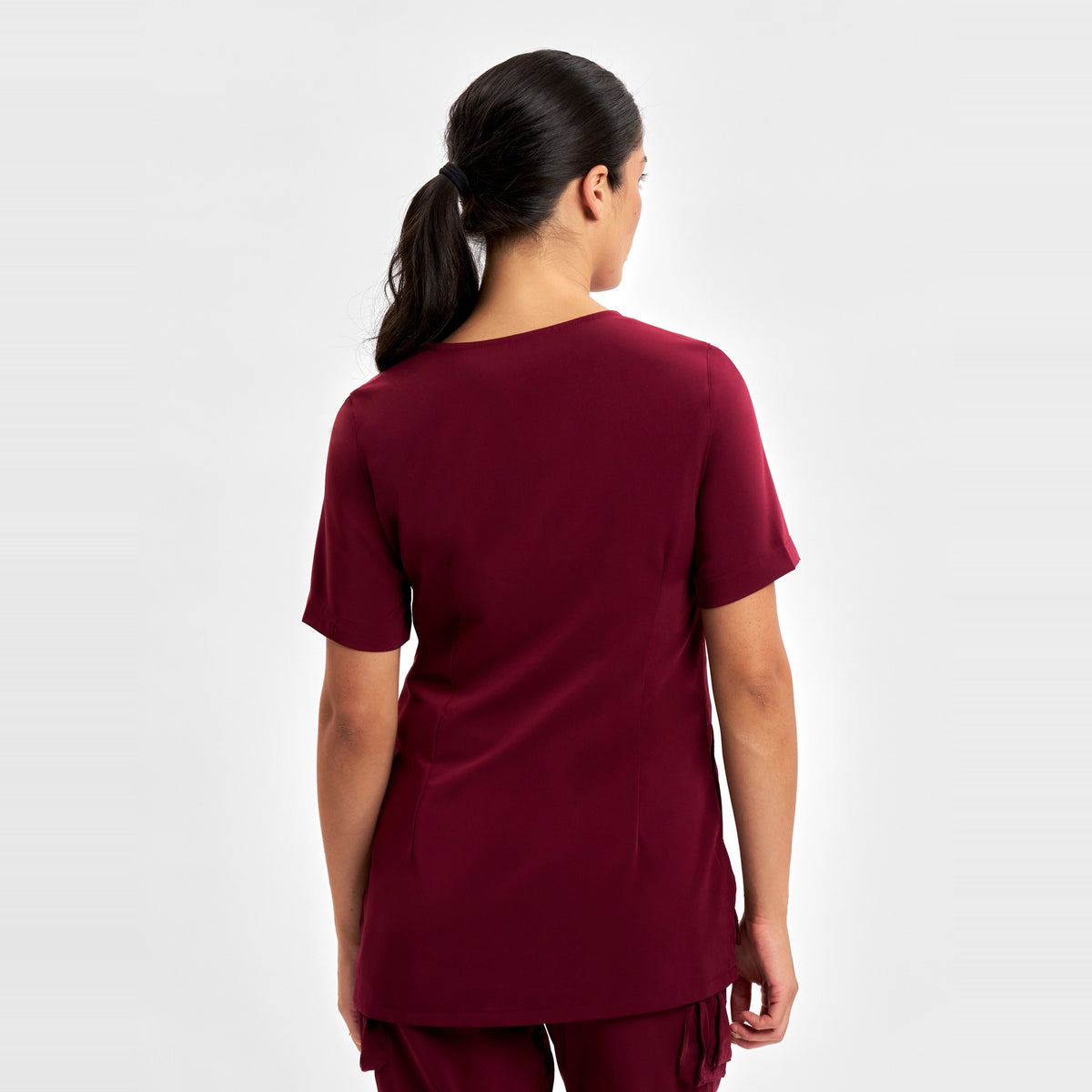 Inaura Avery Womens Round Neck Scrub Top CST942LS in Burgundy, worn by model, view 4
