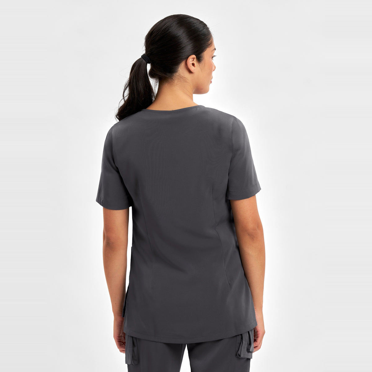 Inaura Avery Womens Round Neck Scrub Top CST942LS in Charcoal, worn by model, view 4