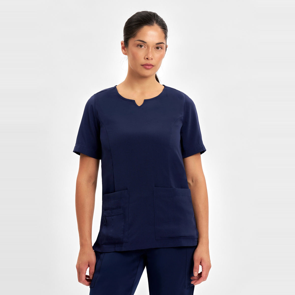 Inaura Avery Womens Round Neck Scrub Top CST942LS in Midnight Navy, worn by model