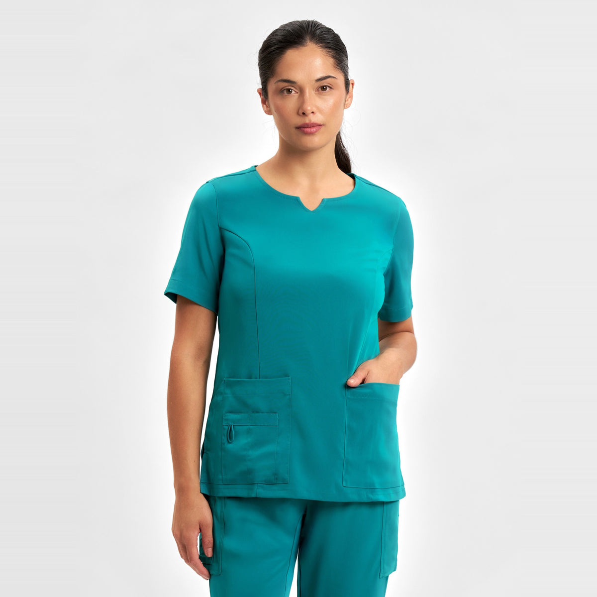 Inaura Avery Womens Round Neck Scrub Top CST942LS in Teal, worn by model