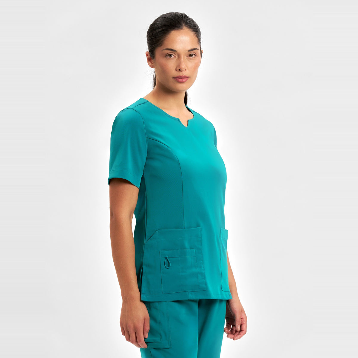 Inaura Avery Womens Round Neck Scrub Top CST942LS in Teal, worn by model, view 3