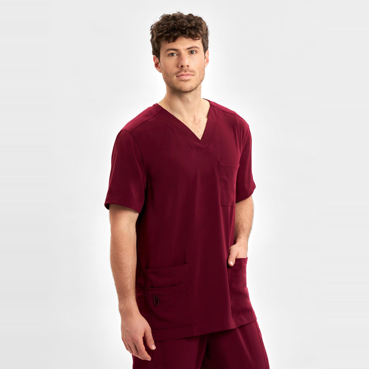 Inaura Avery Mens V-Neck Scrub Top CST945MS in Burgundy, worn by model, view 3