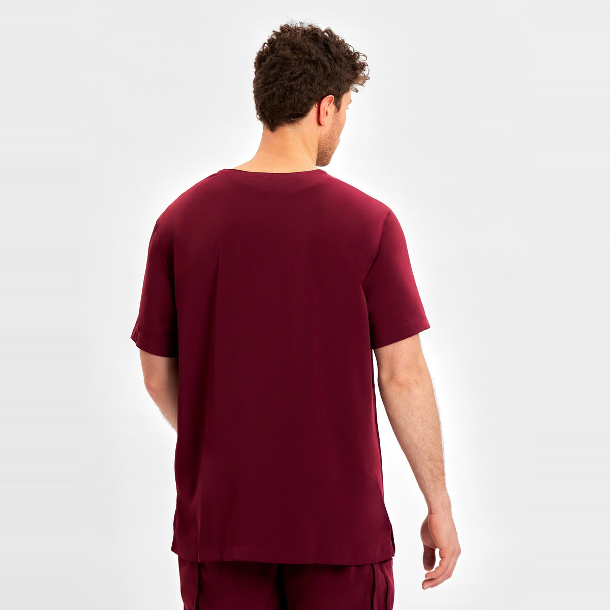 Inaura Avery Mens V-Neck Scrub Top CST945MS in Burgundy, worn by model, view 4