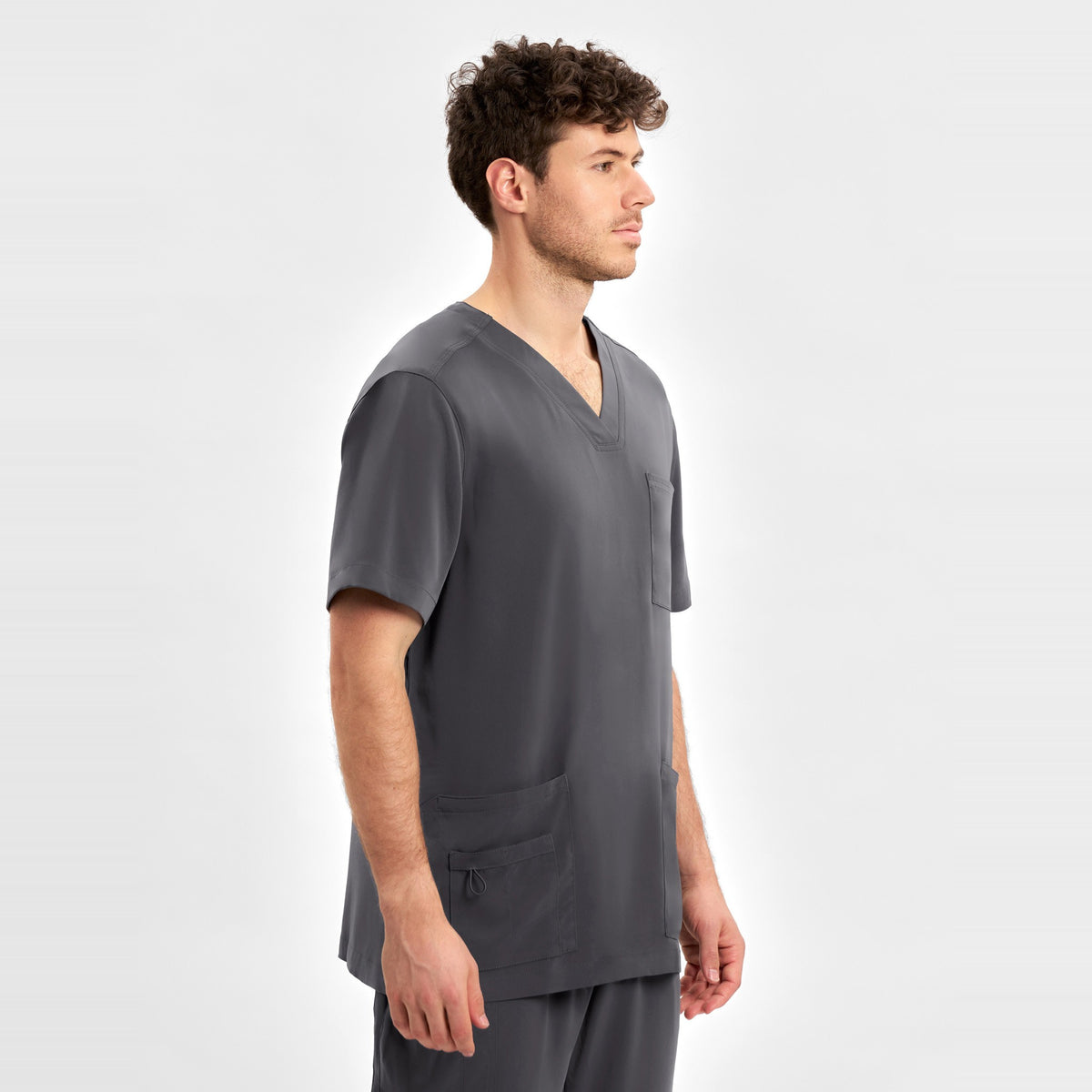 Inaura Avery Mens V-Neck Scrub Top CST945MS in Charcoal, worn by model, view 4