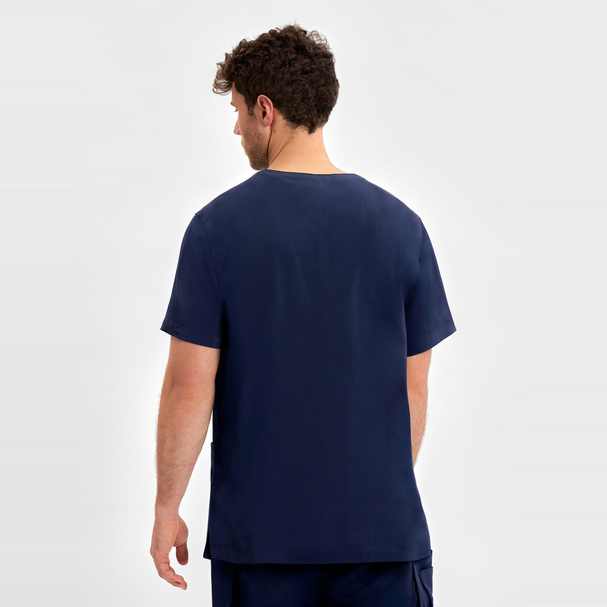 Inaura Avery Mens V-Neck Scrub Top CST945MS in Midnight Navy, worn by model, view 4