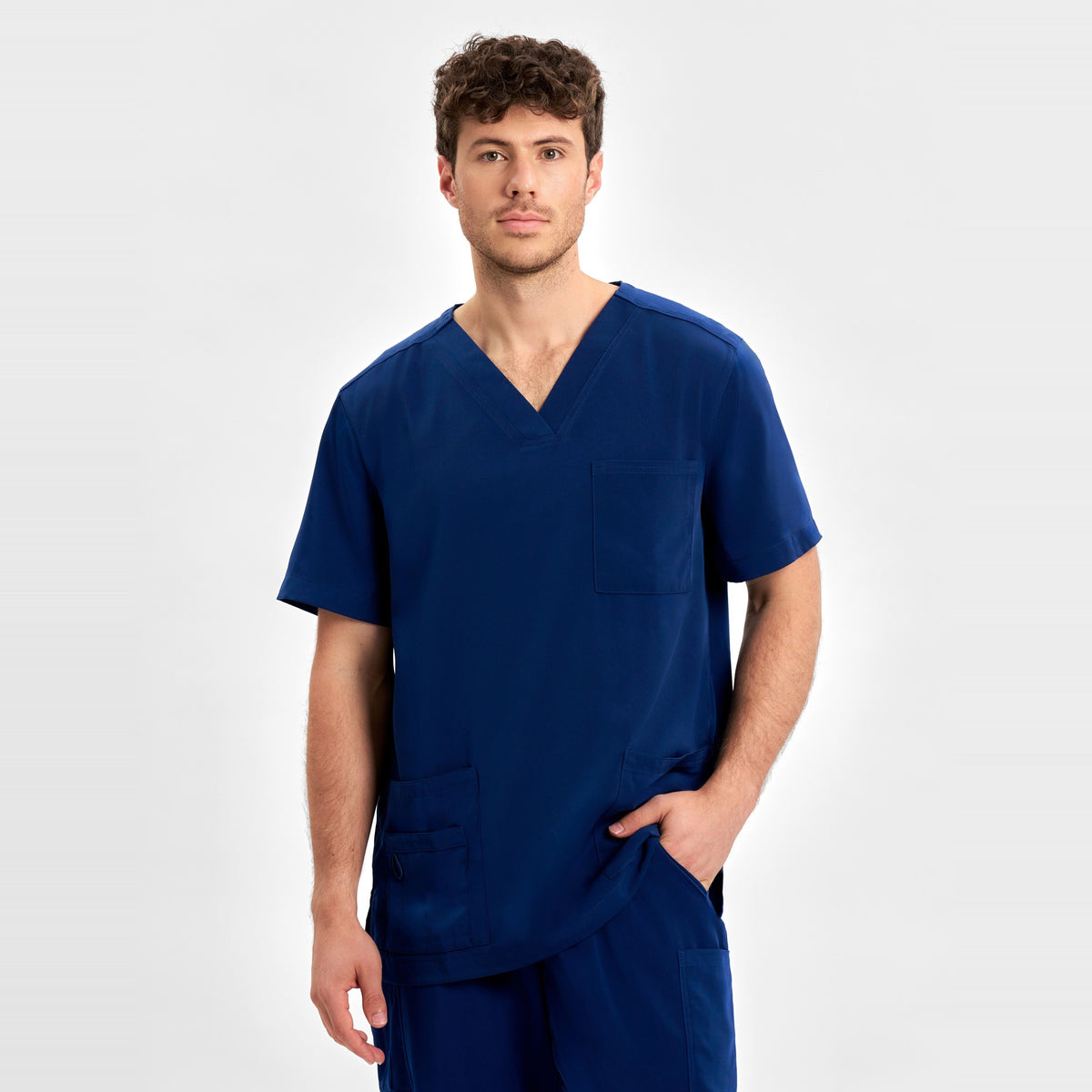 Inaura Avery Mens V-Neck Scrub Top CST945MS in Navy, worn by model