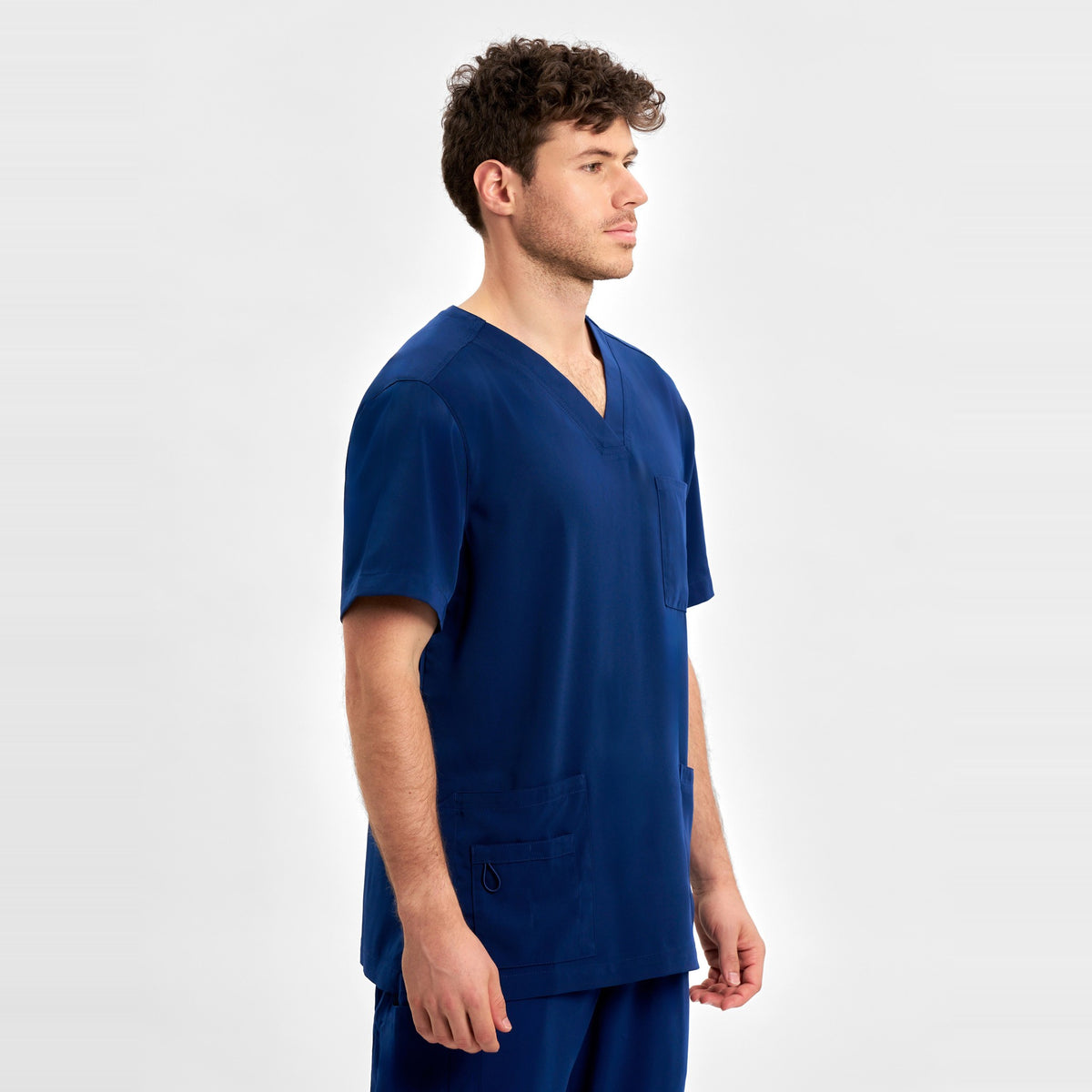 Inaura Avery Mens V-Neck Scrub Top CST945MS in Navy, worn by model, view 3