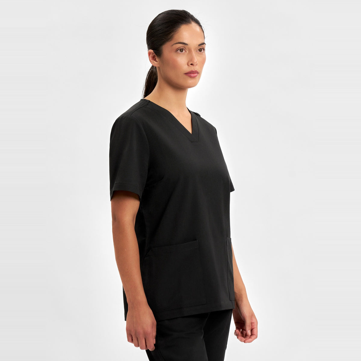 Inaura Pulse Womens V-Neck Scrub Top CU543LS in Black, worn by model, view 4