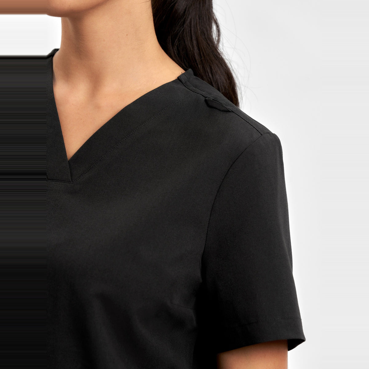 Inaura Pulse Womens V-Neck Scrub Top CU543LS in Black, worn by model, view 5