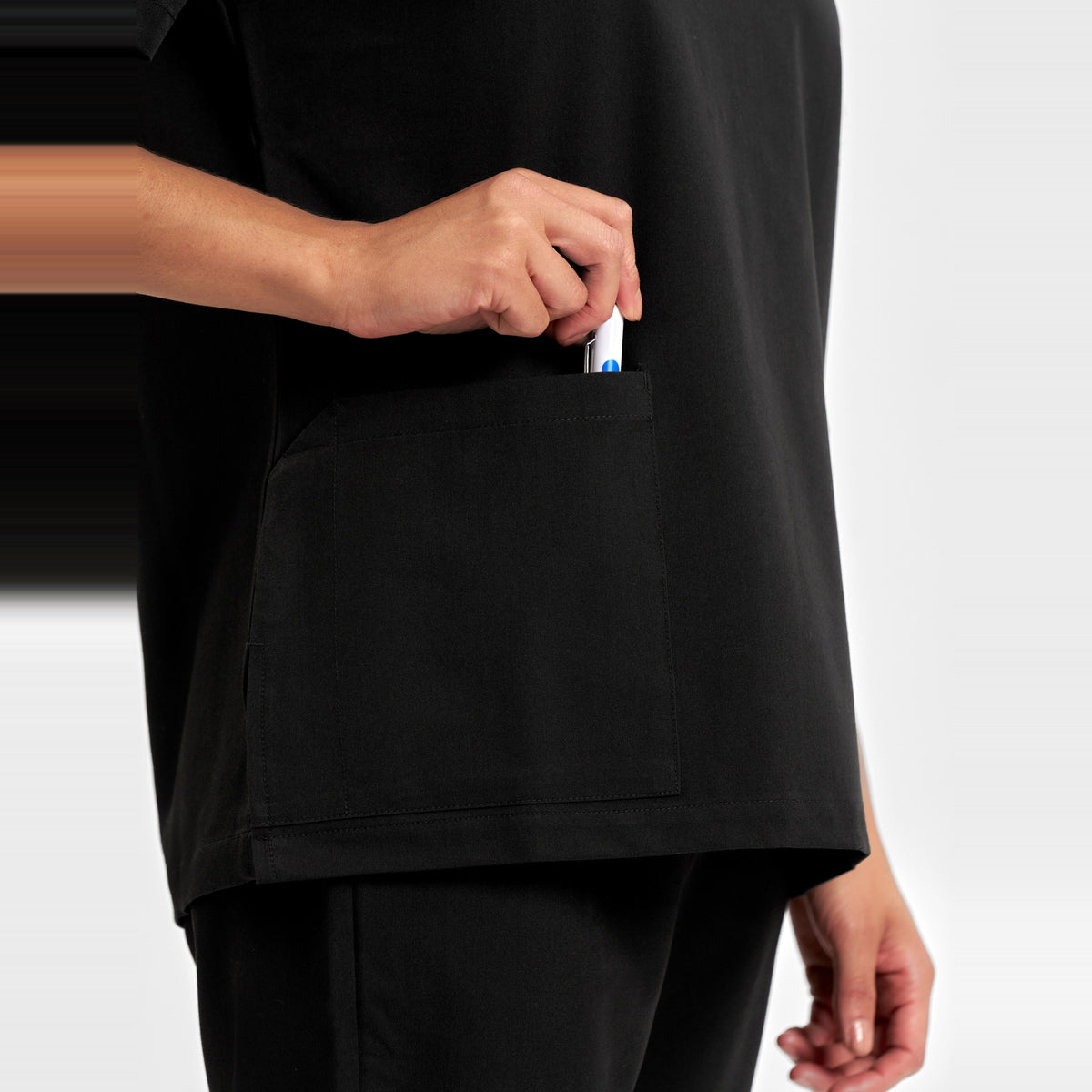 Inaura Pulse Womens V-Neck Scrub Top CU543LS in Black, worn by model, view 6