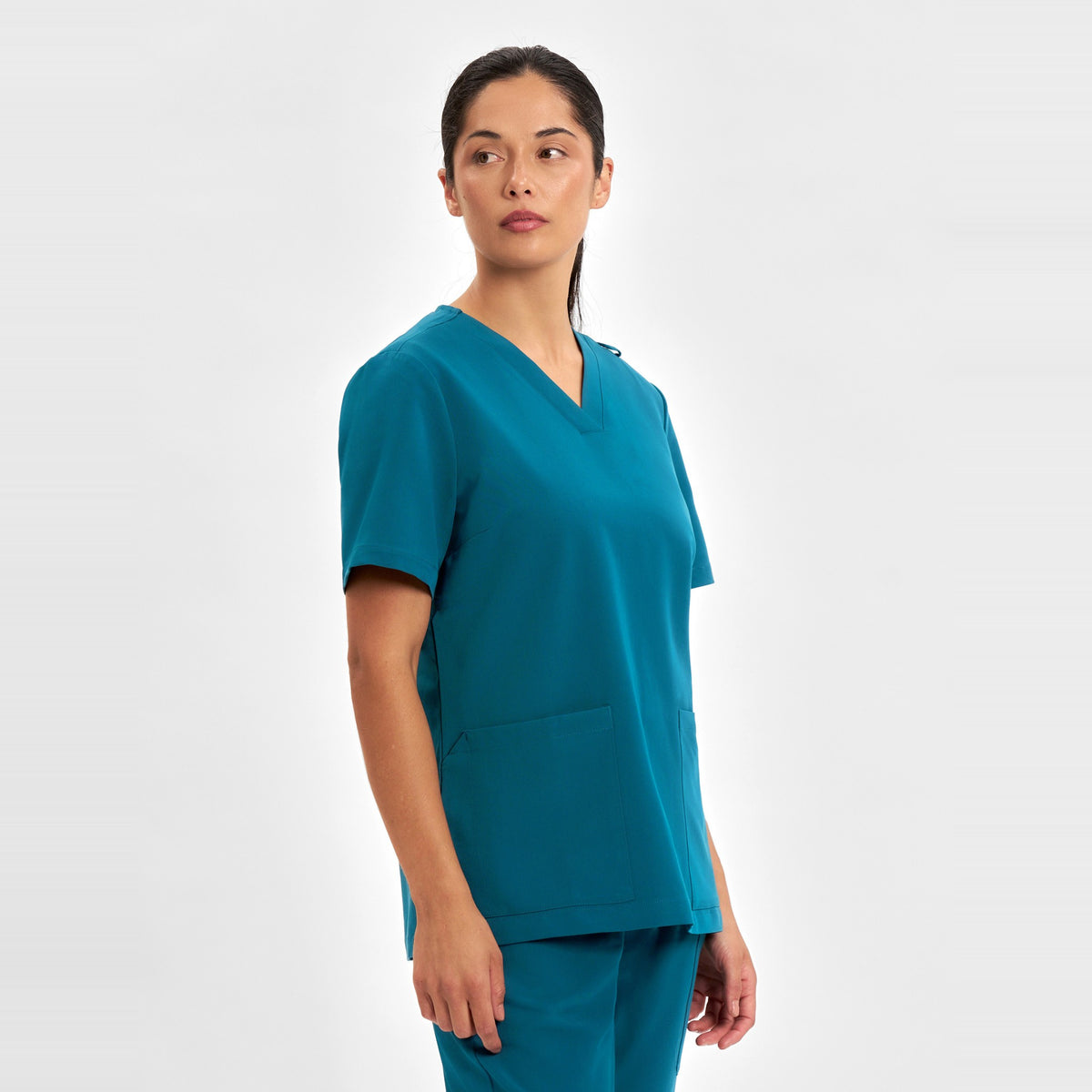 Inaura Pulse Womens V-Neck Scrub Top CU543LS in Caribbean Blue, worn by model, view 3