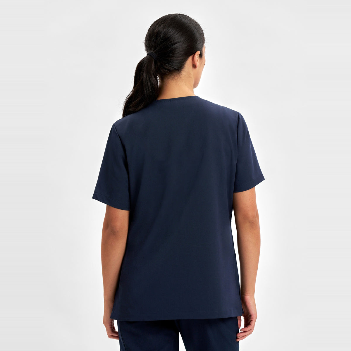 Inaura Pulse Womens V-Neck Scrub Top CU543LS in Midnight Navy, worn by model, view 4