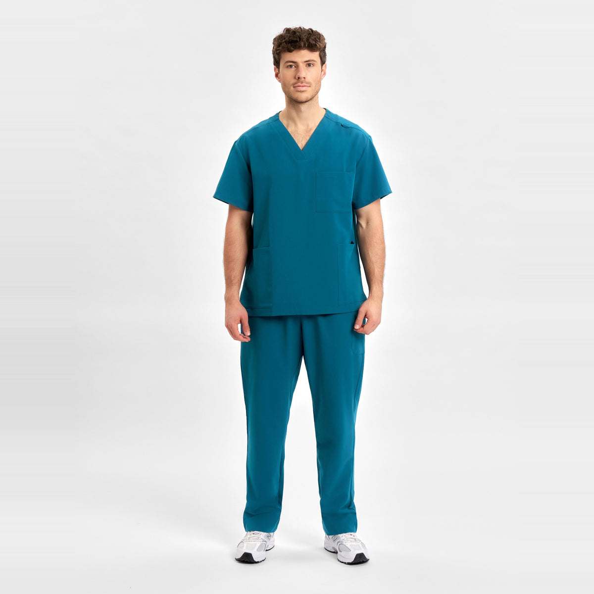 Inaura Pulse Unisex V-Neck Scrub Top CU544US in Caribbean Blue, worn by model, view 2