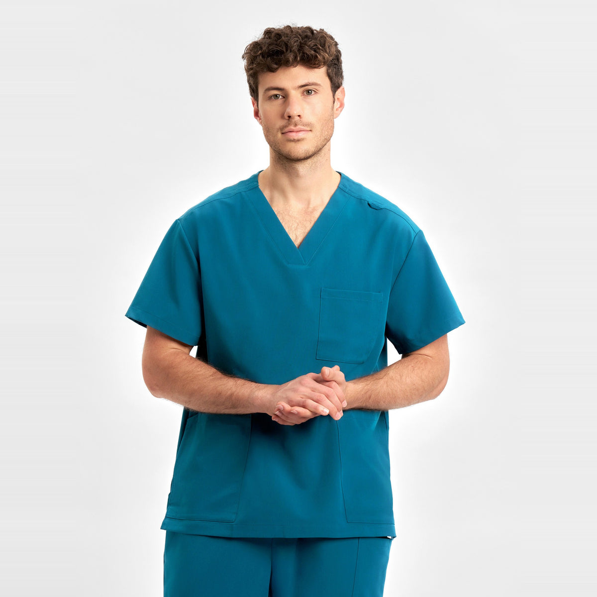 Inaura Pulse Unisex V-Neck Scrub Top CU544US in Caribbean Blue, worn by model, view 3