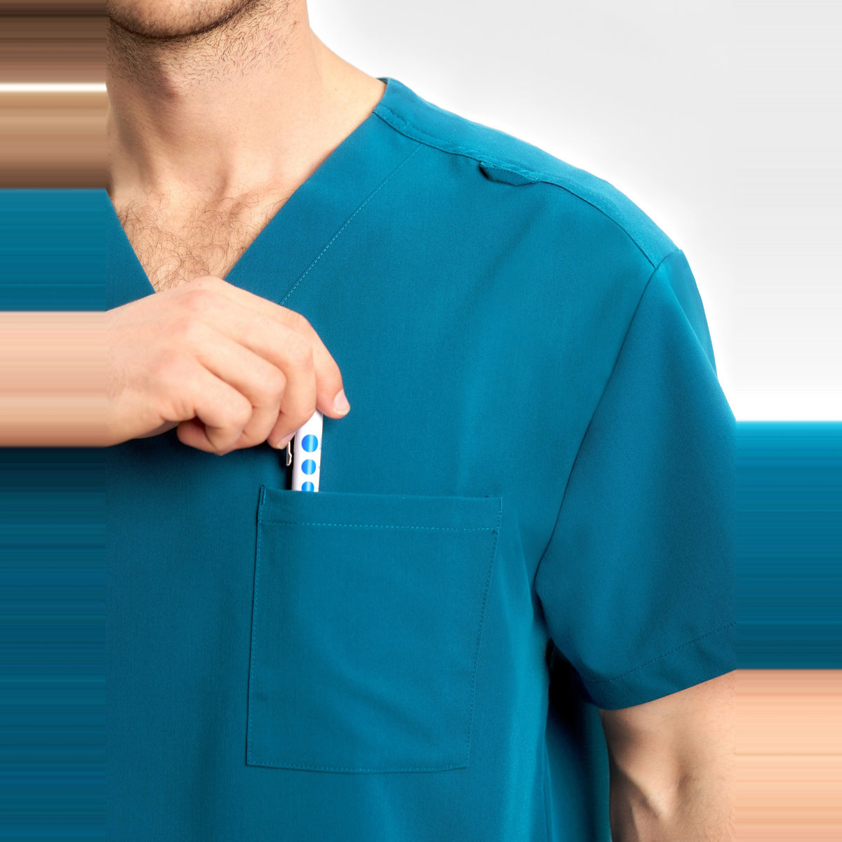 Inaura Pulse Unisex V-Neck Scrub Top CU544US in Caribbean Blue, worn by model, view 6