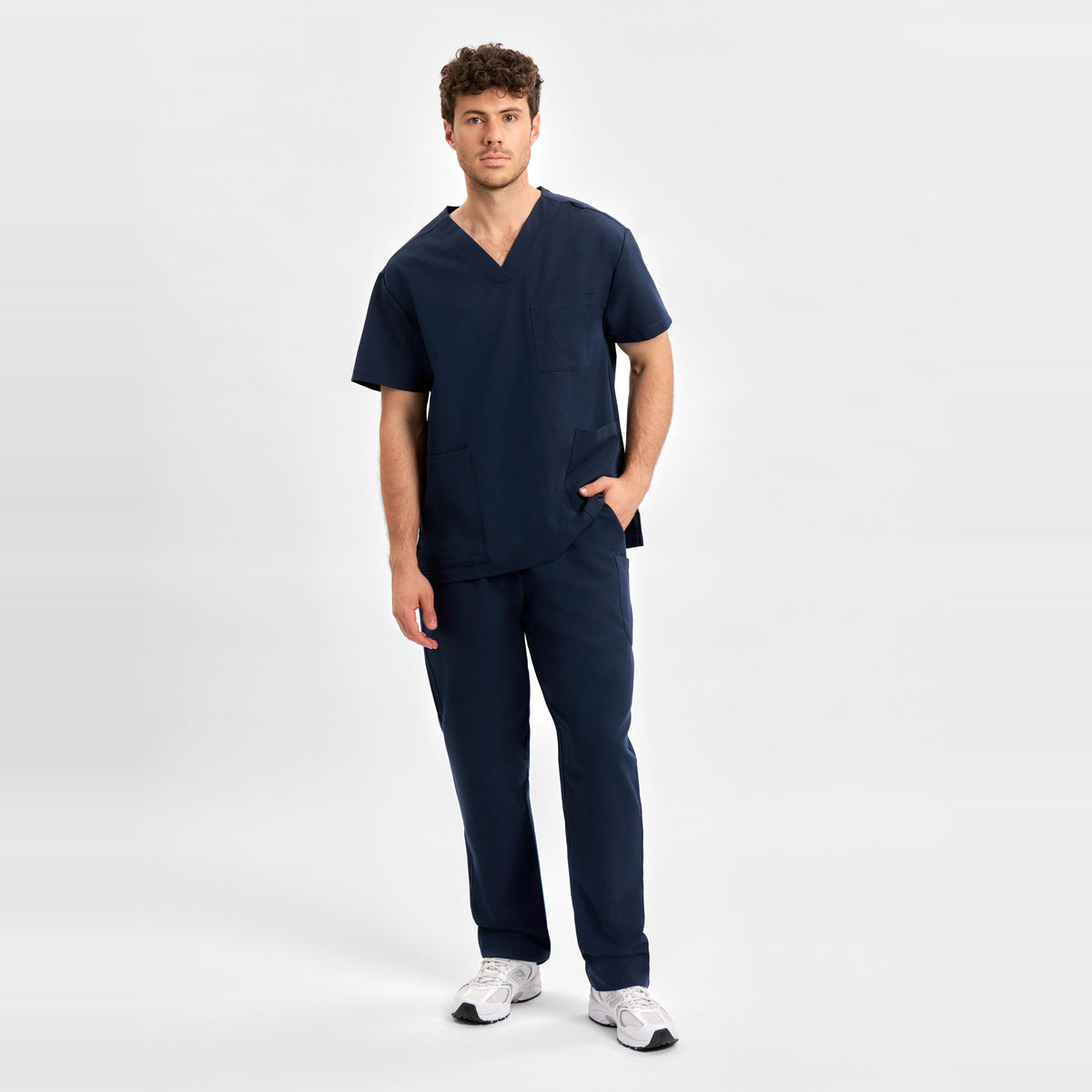 Inaura Pulse Unisex V-Neck Scrub Top CU544US in Midnight Navy, worn by model, view 2