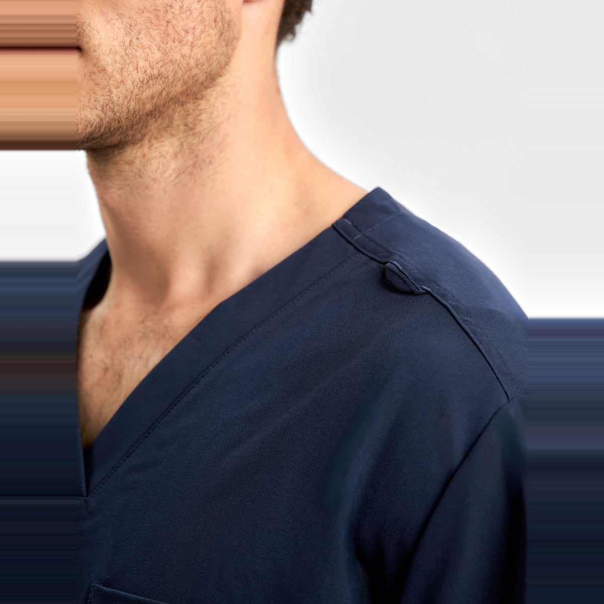 Inaura Pulse Unisex V-Neck Scrub Top CU544US in Midnight Navy, worn by model, view 5
