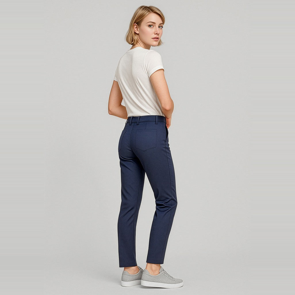 Biz Corporates Traveller Womens Slim Leg Stretch Chino Pant RGP263L in Navy, worn by model