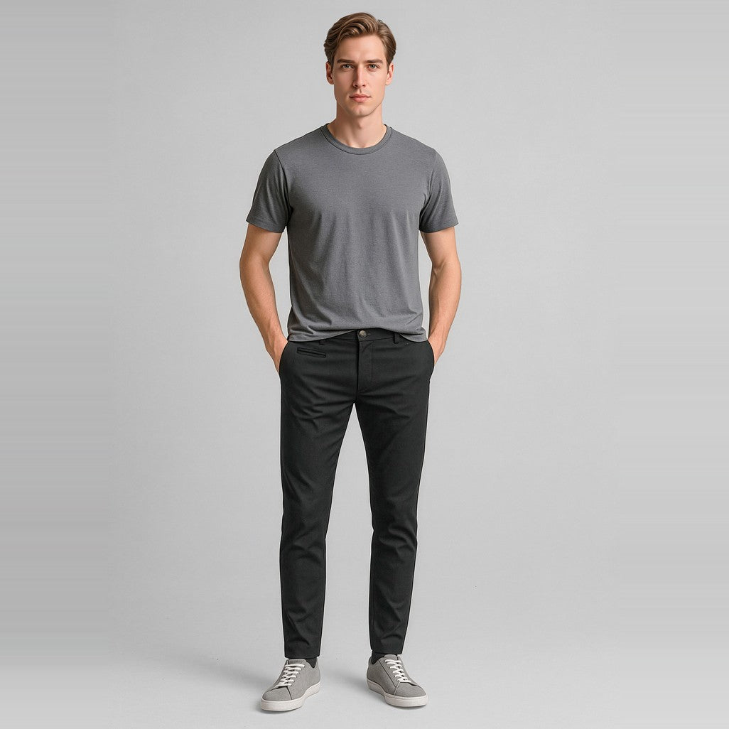 Biz Corporates Traveller Mens Tapered Stretch Chino Pant RGP263M in Black, worn by model