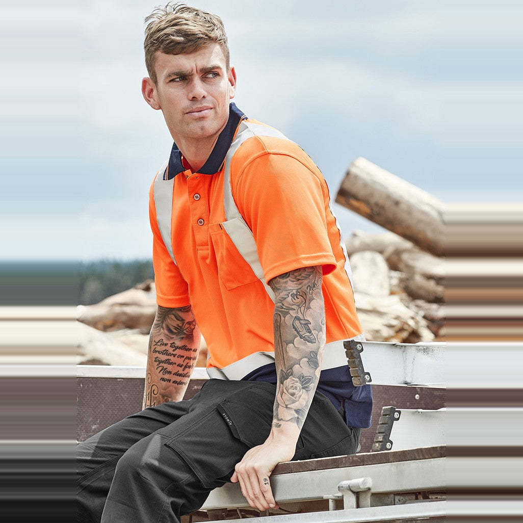 Syzmik Mens Hi Vis Spliced Short Sleeve Polo - Shoulder Taped ZH233, worn by model
