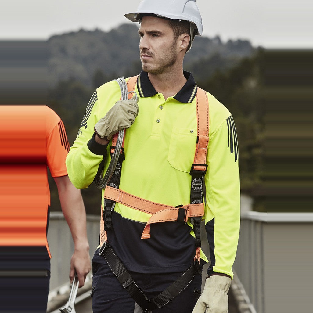 Syzmik Mens Hi Vis Flux Long Sleeve Polo ZH310 in Yellow/Navy, worn by model, view 2