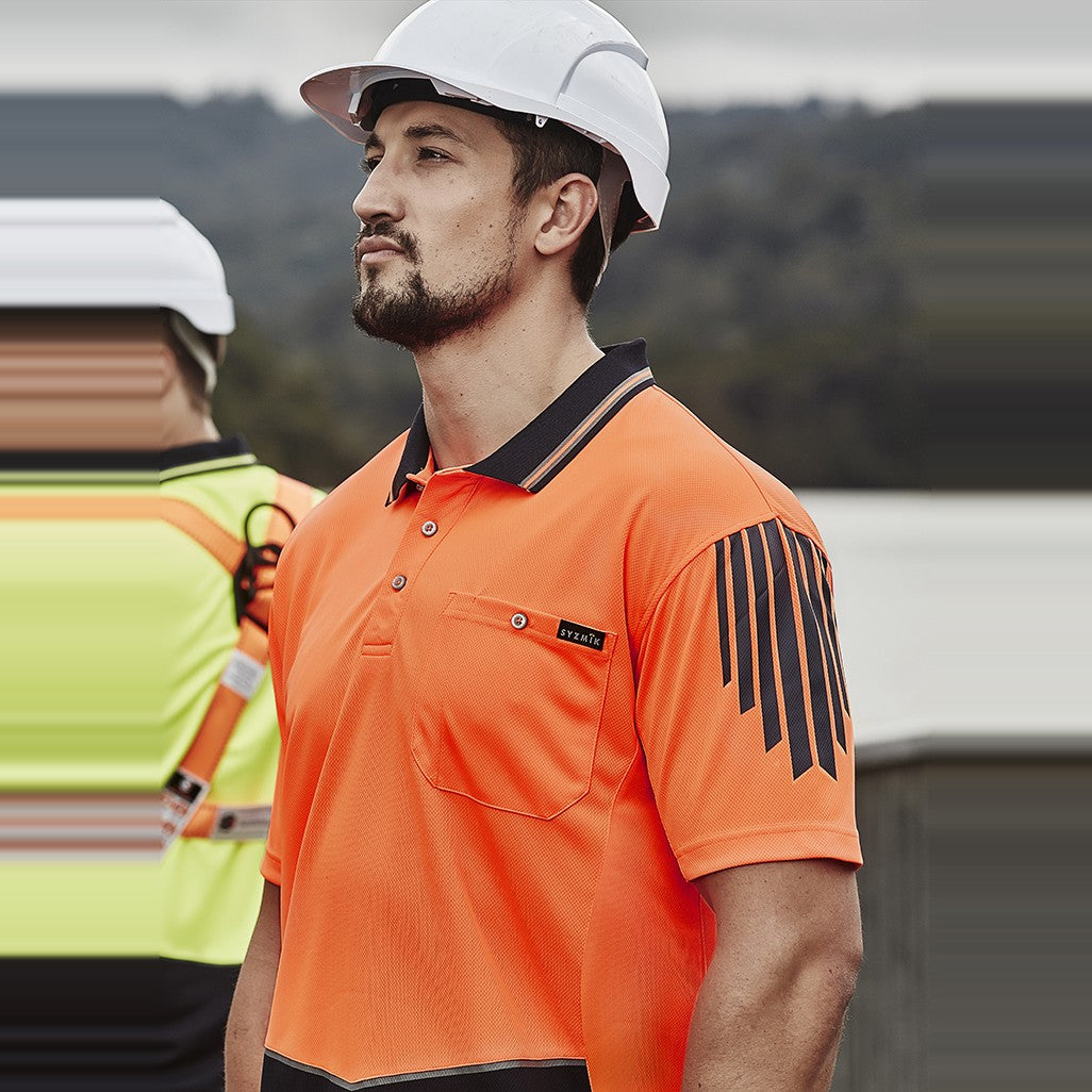 Syzmik Mens Hi Vis Flux Short Sleeve Polo ZH315, worn by model