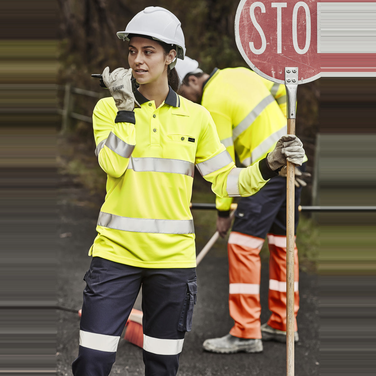 Syzmik Unisex Hi Vis Bio Motion Taped Polo ZH380 in Yellow, worn by model