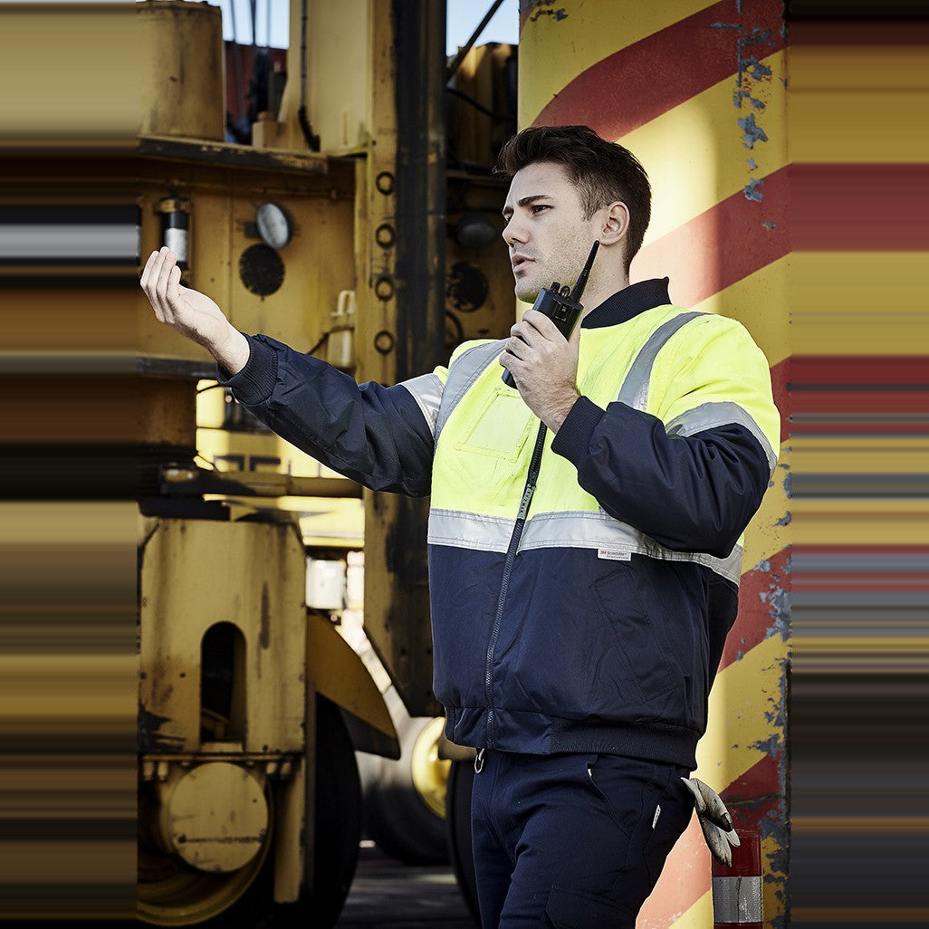 Syzmik Mens Hi Vis Quilted Flying Jacket ZJ351, worn by model