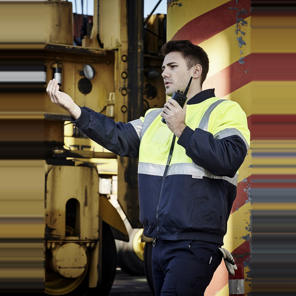 Syzmik Mens Hi Vis Quilted Flying Jacket ZJ351 in Yellow/Navy, worn by model