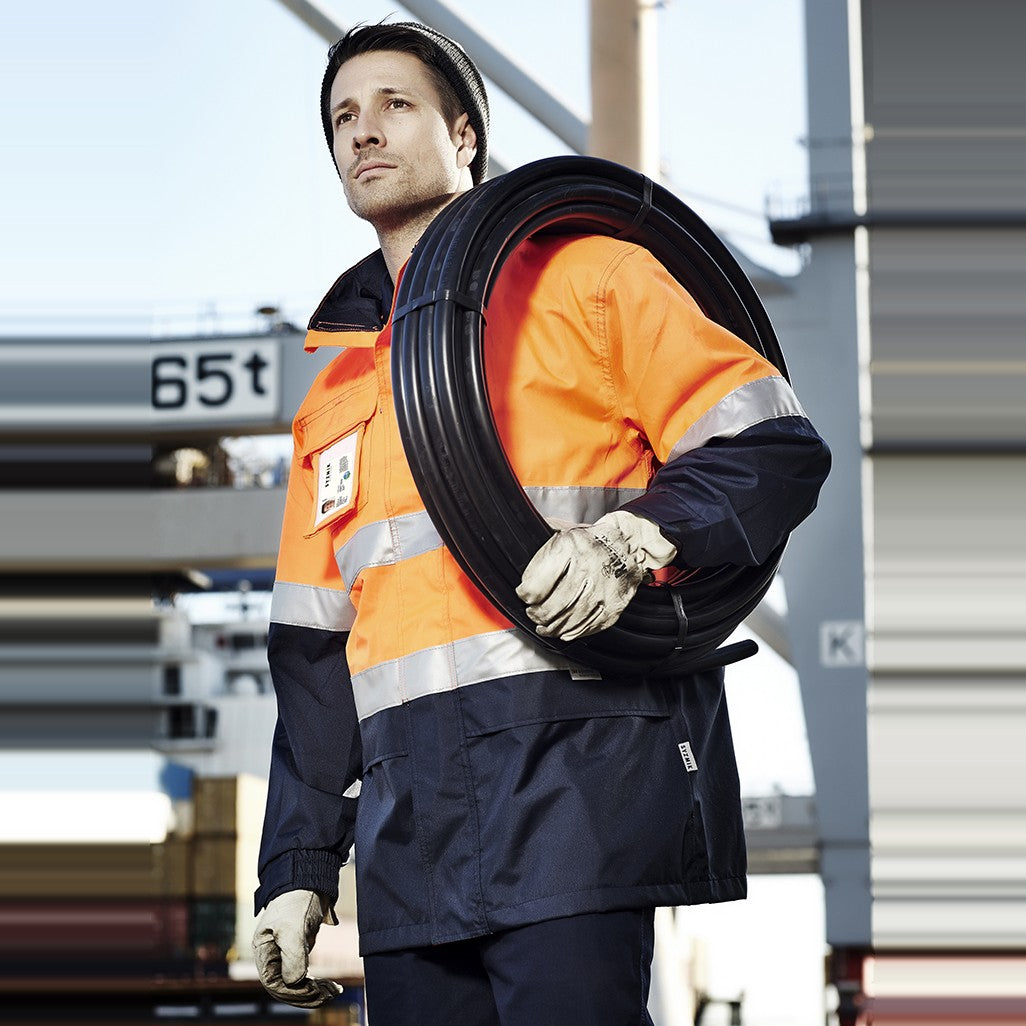 Syzmik Mens Hi Vis Ultralite Waterproof Jacket ZJ357, worn by model