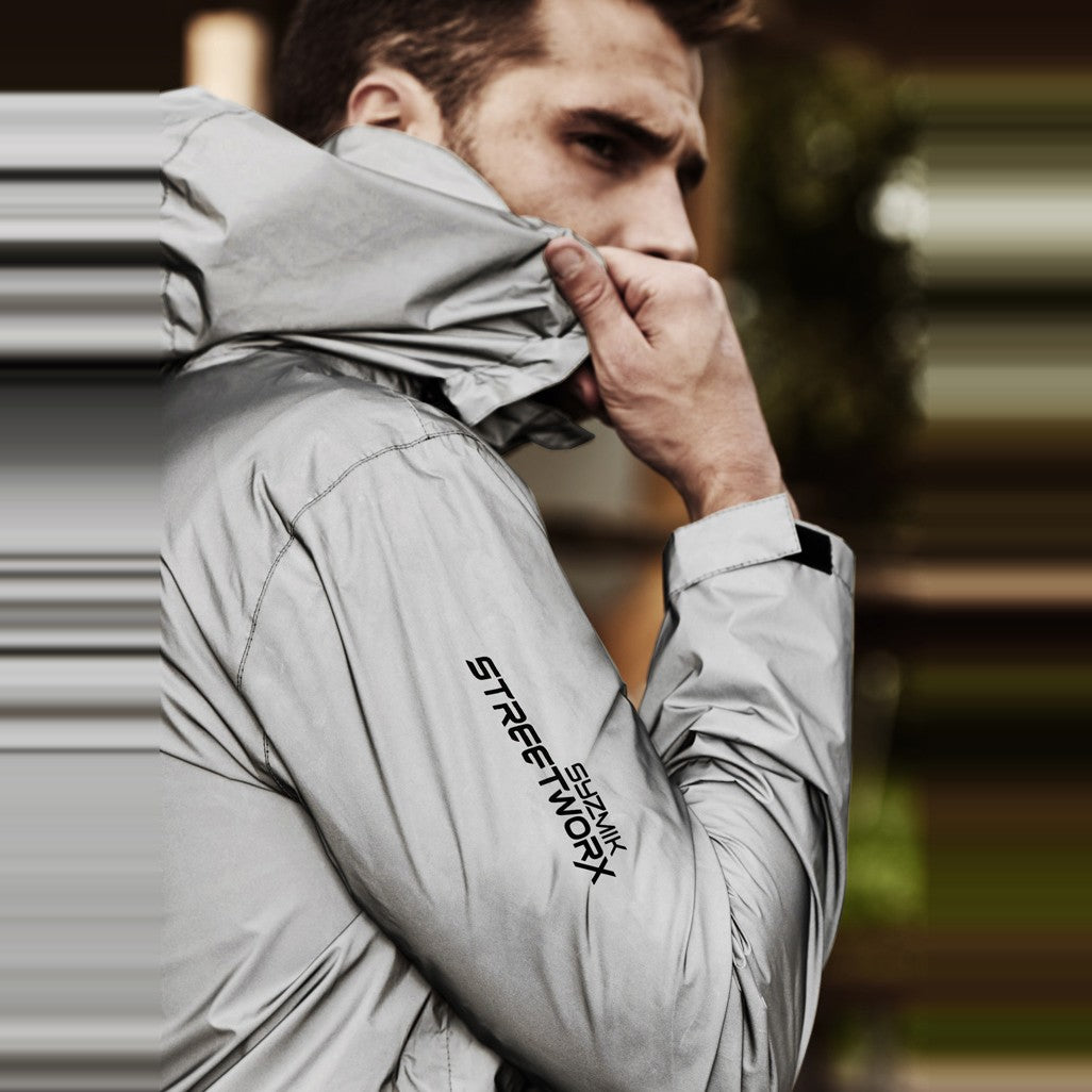 Syzmik Unisex Streetworx Reflective Waterproof Jacket ZJ380 in Reflective Silver, worn by model, view 2