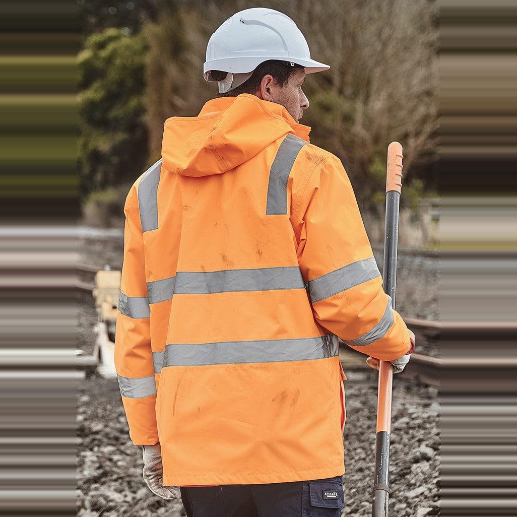 Syzmik Unisex Hi Vis VIC Rail 4 In 1 Waterproof Jacket ZJ580 in VIC Rail Orange, worn by model, view 2