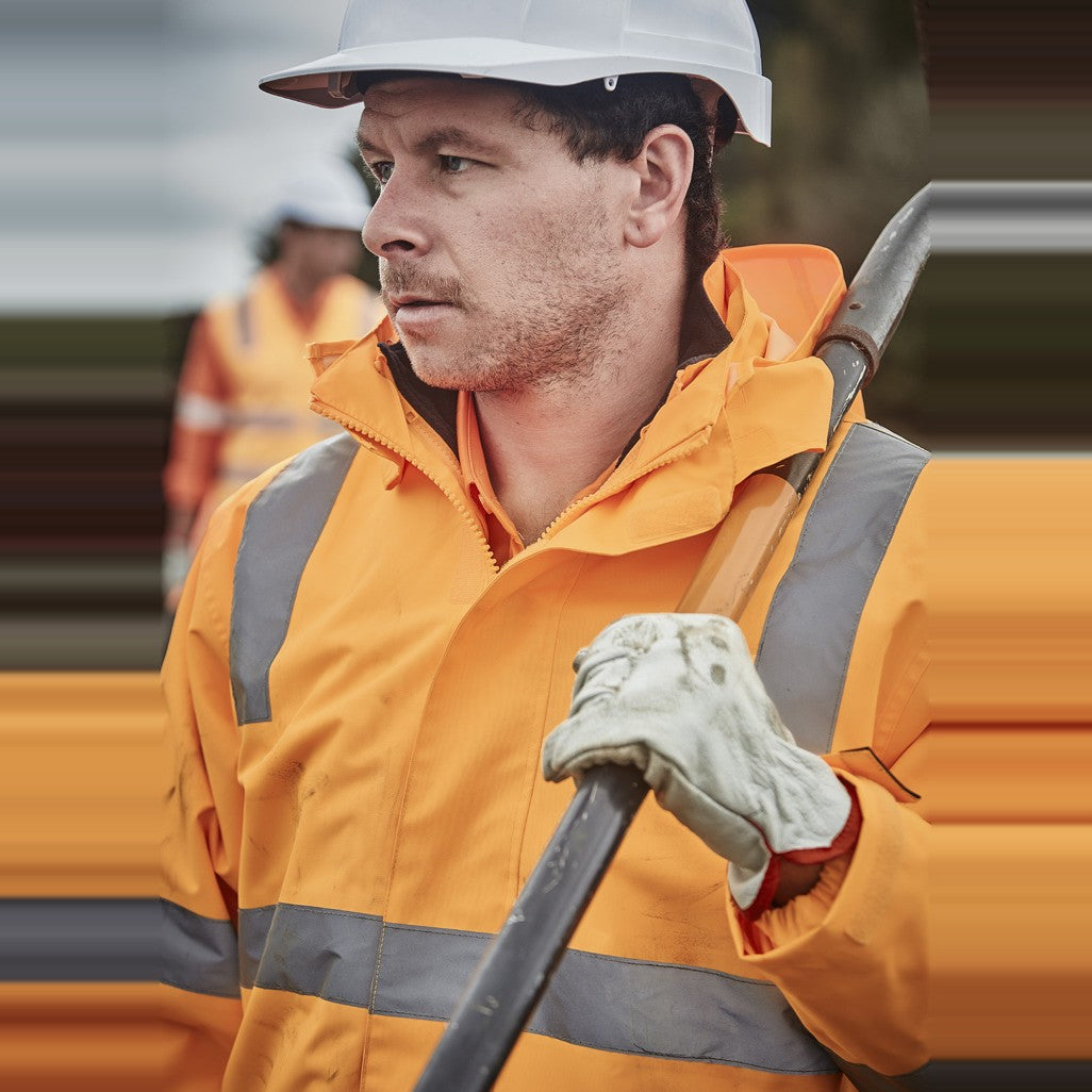 Syzmik Unisex Hi Vis VIC Rail 4 In 1 Waterproof Jacket ZJ580 in VIC Rail Orange, worn by model, view 3