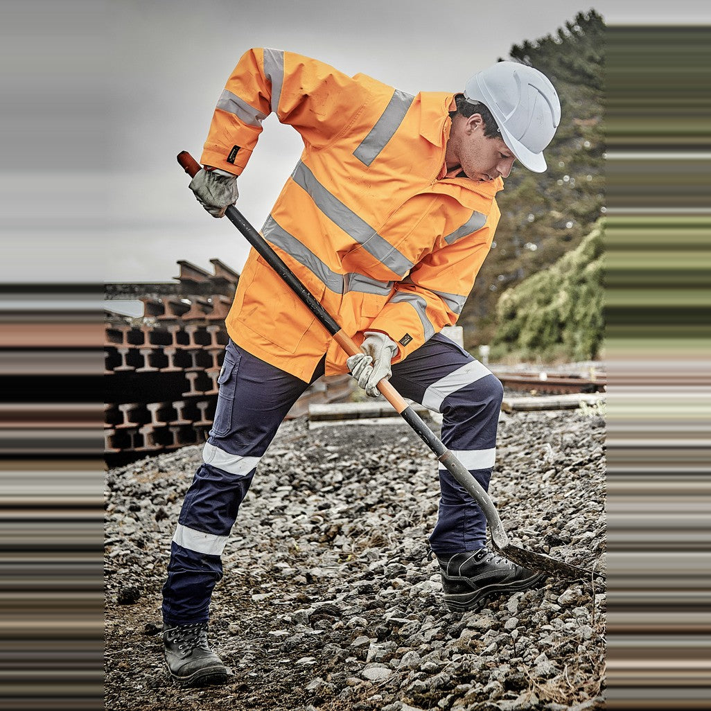 Syzmik Unisex Hi Vis VIC Rail 4 In 1 Waterproof Jacket ZJ580 in VIC Rail Orange, worn by model, view 5