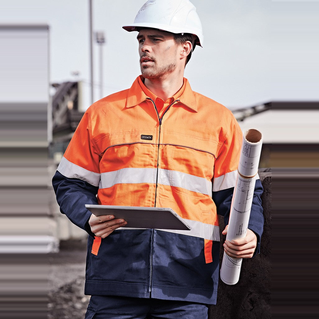 Syzmik Mens Hi Vis Cotton Drill Jacket ZJ590 in Orange/Navy, worn by model