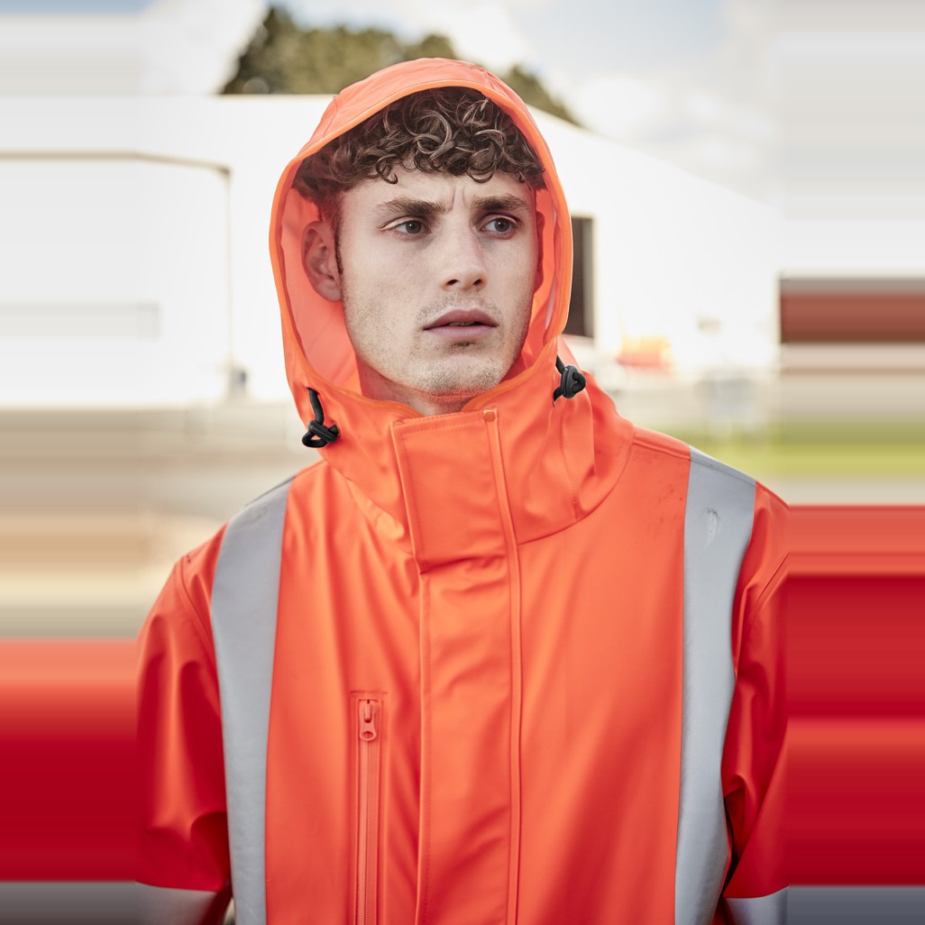 Syzmik Mens Hi Vis X Back Heavy Duty Waterproof Jacket ZJ620-AU in Orange, worn by model, view 7