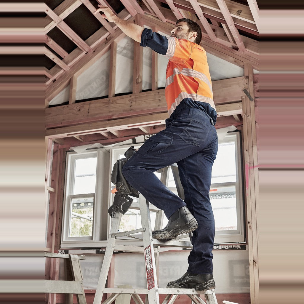 Syzmik Mens Summer Cargo Pant (Stout) ZP145S in Navy, worn by model