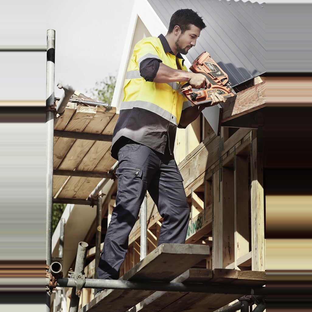 Syzmik Mens Lightweight Drill Cargo Pant ZP505 in Navy, worn by model