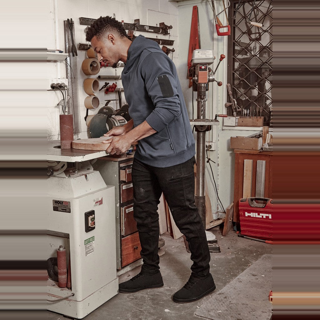 Syzmik Mens Streetworx Stretch Jean ZP540 in Black, worn by model
