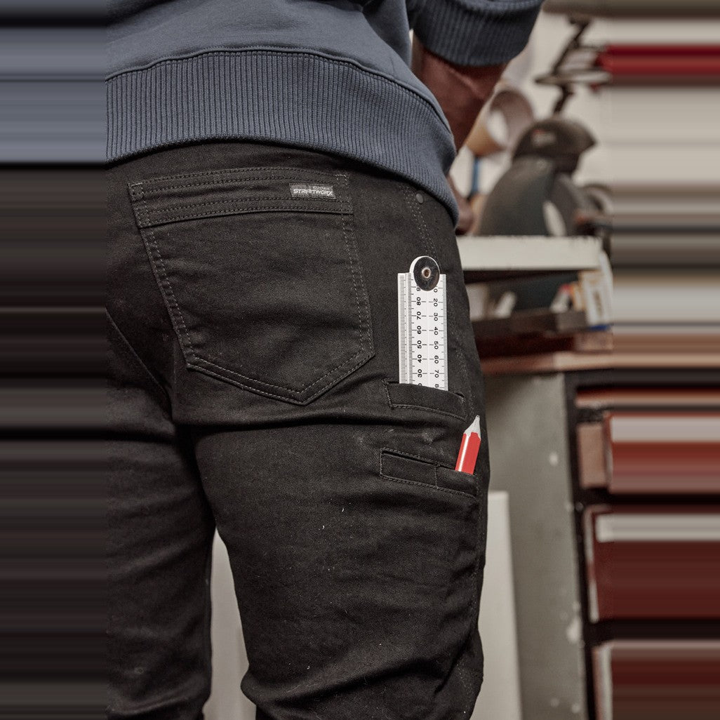 Syzmik Mens Streetworx Stretch Jean ZP540 in Black, worn by model, view 4