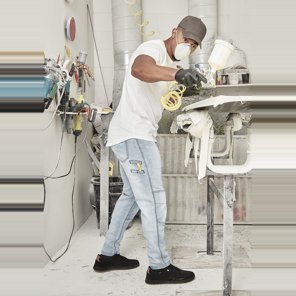 Syzmik Mens Streetworx Stretch Jean ZP540 in Light Blue, worn by model