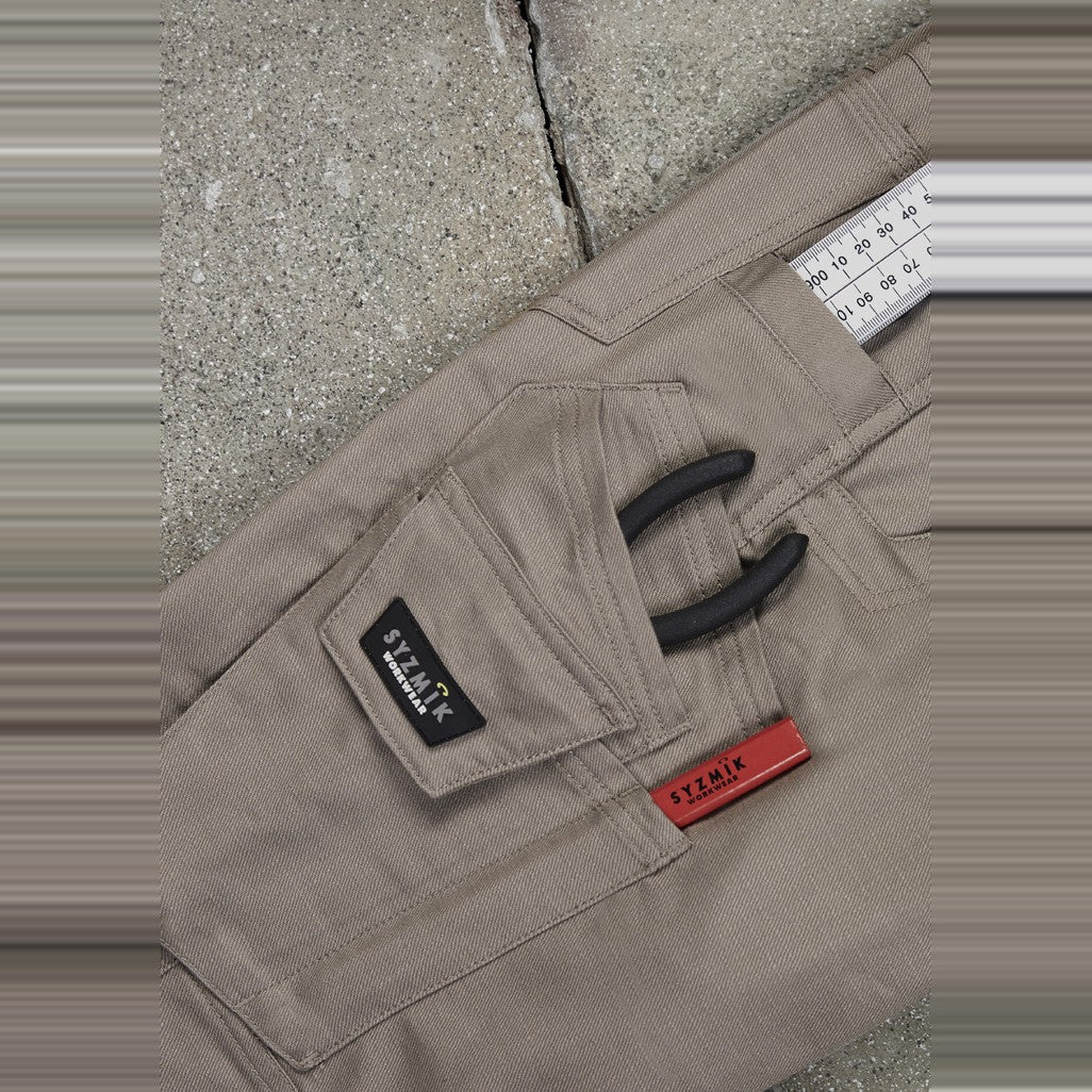 Syzmik Mens Rugged Cooling Stretch Pant ZP604 in Khaki, worn by model, view 3