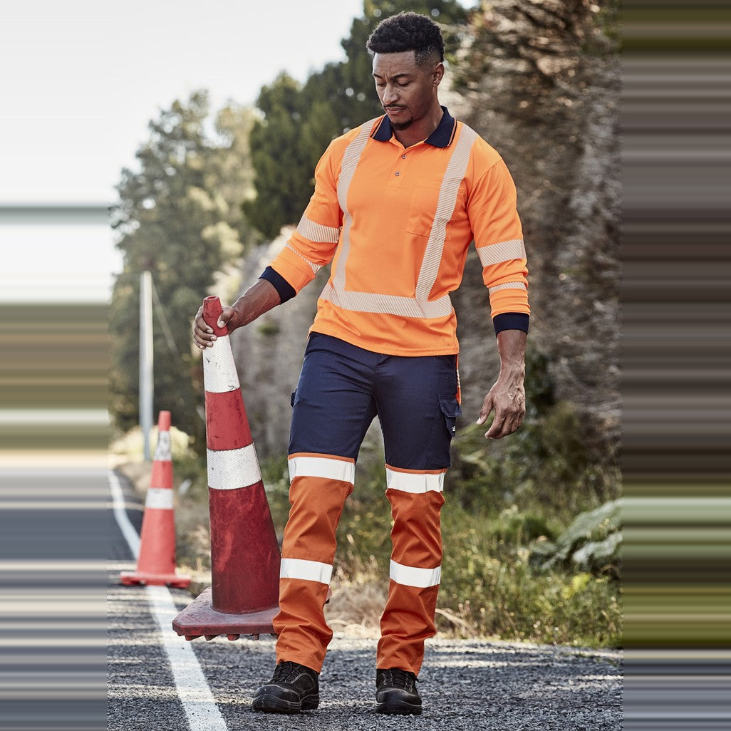 Syzmik Mens Bio Motion Hi Vis Taped Pant ZP980 in Orange/Navy, worn by model, view 2