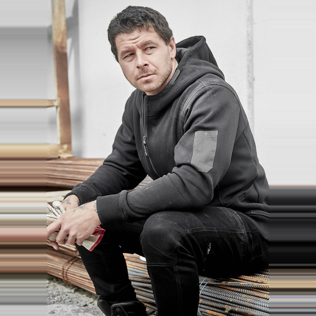 Syzmik Unisex Zip Front Multi-Pocket Hoodie ZT468 in Black/Charcoal, worn by model, view 5