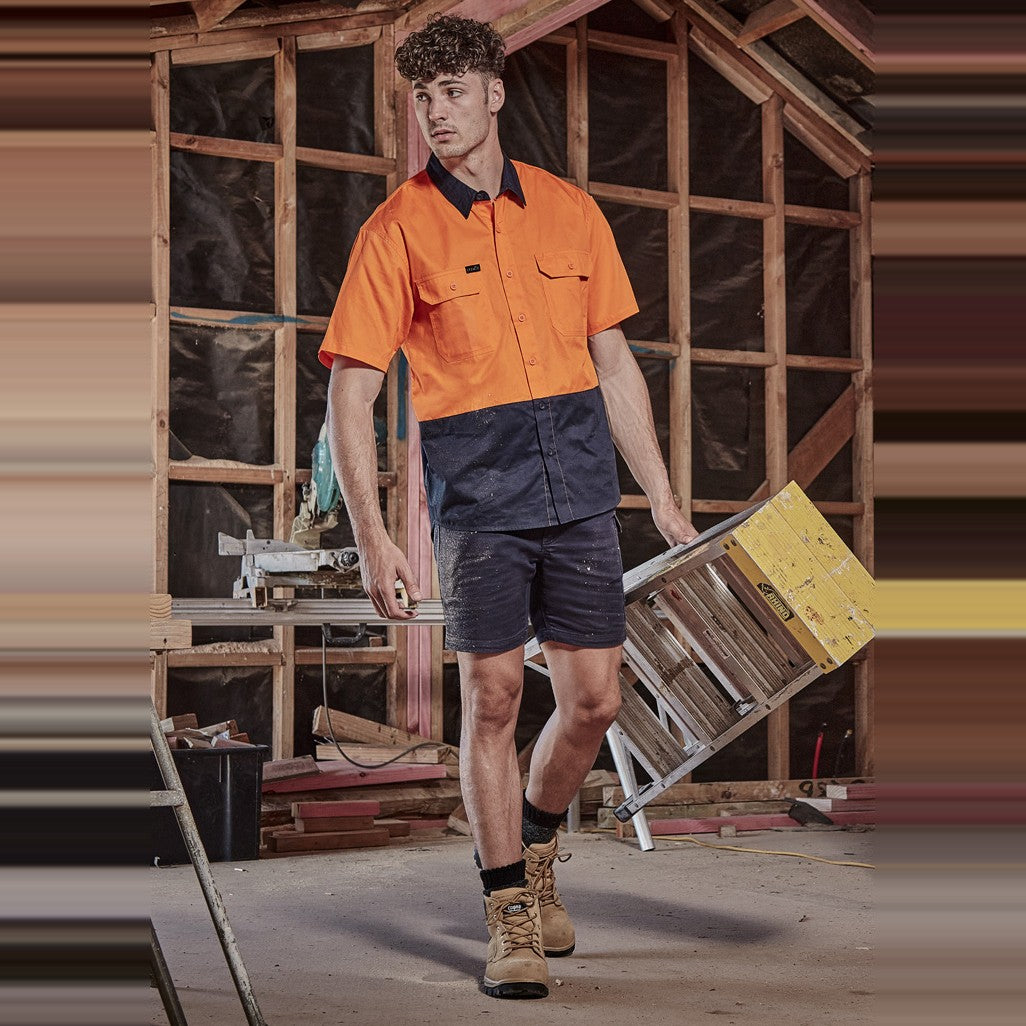 Syzmik Mens Hi Vis Short Sleeve Shirt ZW115 in Orange/Navy, worn by model, view 2