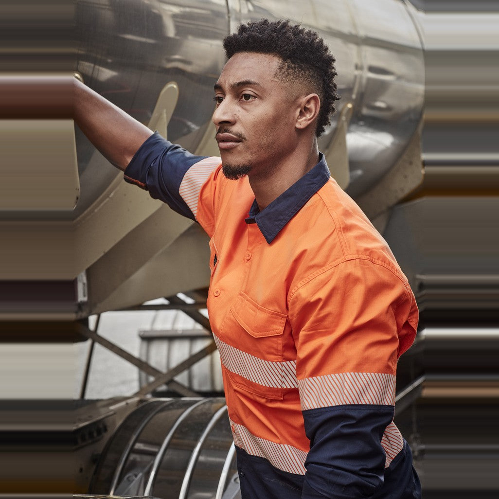 Syzmik Mens Rugged Cooling Hi Vis Segmented Tape Long Sleeve Shirt ZW229 in Orange/Navy, worn by model