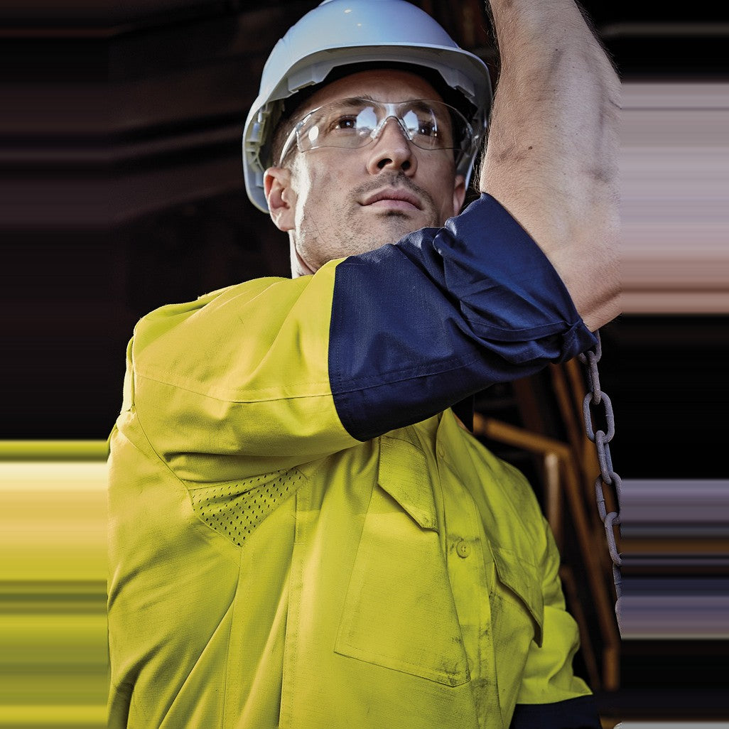 Syzmik Mens Closed Front Long Sleeve Shirt ZW560 in Yellow/Navy, worn by model